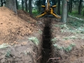 backhoe working on trench construction